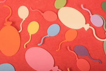 colorful balloons on red background


