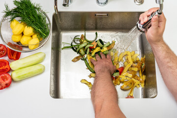 Modern sink with food waste in the hole of the disposer
