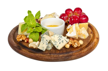 Various types of cheese with honey, nuts and grapes on plate, isolated on white