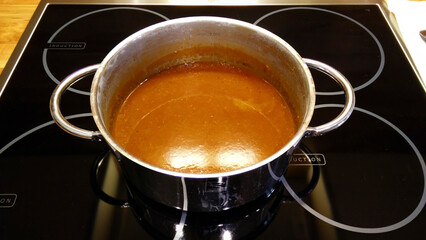 Saucepan with boiled down brown sauce