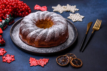Homemade delicious round Christmas pie with red berries on a ceramic plate