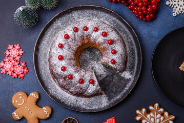 Homemade delicious round Christmas pie with red berries on a ceramic plate