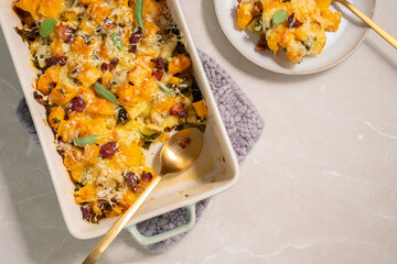 Autumn pumpkin casserole with leek, bacon, cheese and kale