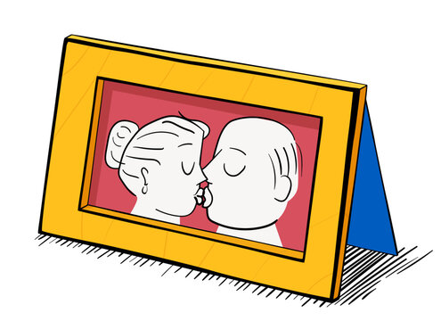 Picture of a kissing couple in a wooden frame