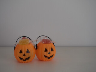 halloween background with pumpkins full of candy