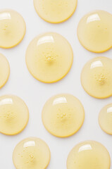 Yellow drops of gel close up. Cosmetic product for moisturizing the skin of the face or body.