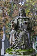 Historic Statue on the mystery old Prague Cemetery, Czech Republic