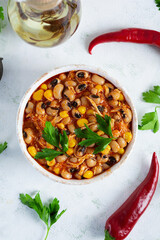Chili con carne in a bowl. Mexican cuisine. Chili with meat, corn and beans