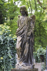 Obraz premium Historic Statue on the mystery old Prague Cemetery, Czech Republic