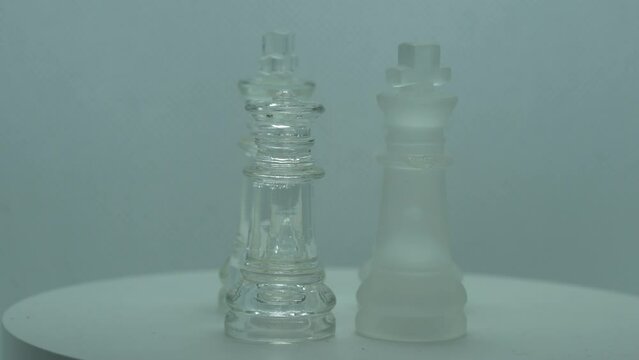 glass chess pieces on the table