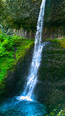 Long double waterfalls near South Falls in the Silver Falls State Park near Salem, Marion County, Oregon. Long exposure photography.