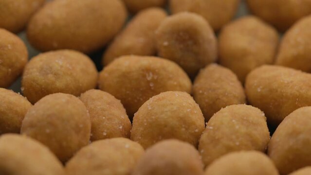 nuts with in pepper rotate in a circle. spicy snack