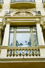 Fototapeta premium Exterior of balcony and window frame of an elegant European residence, Barcelona