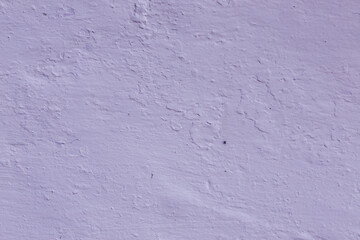 An abstract background of old, uneven plaster.