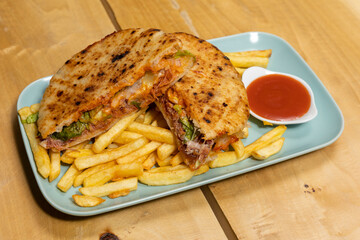 Beef chopped cheese sandwich served with french fries