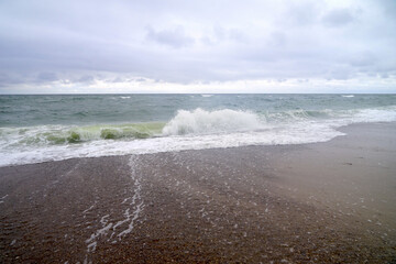 large waves of the ocean meet a gravel beach, sea level, coast, sea, North Sea