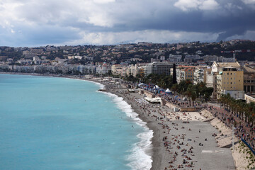 Fototapeta na wymiar Nice, France - 25.09.2022: View of Nice, beaches and the famous Promenade des Anglais from Mont Boron park