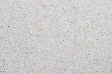Craft paper texture cardboard background with small inclusions of cellulose