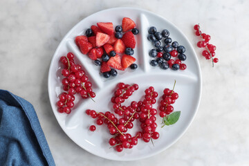 Fresh berries on white plate