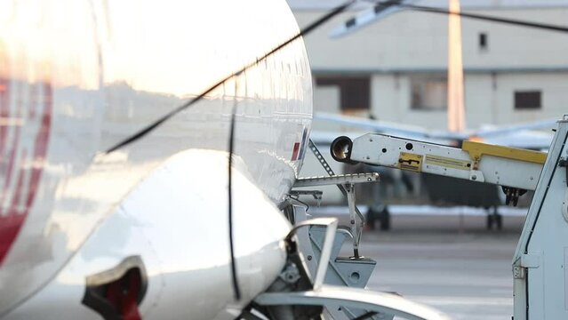 Close-up detail view of belt loading machine car load commercial parcel shipment in small cargo plane compartment. Air mail shipping and logistics service . Commercial charter flight service