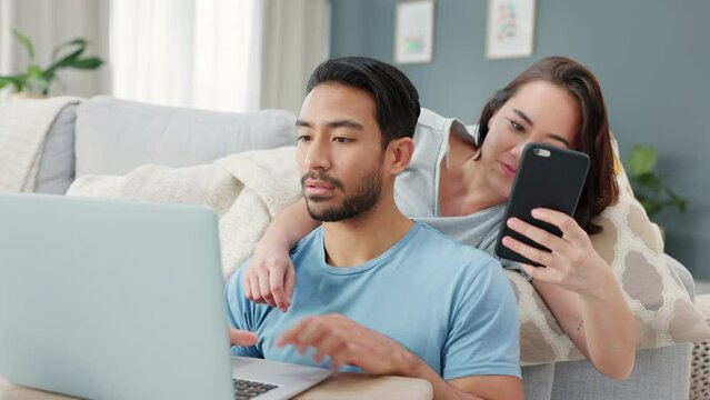 Asian couple, phone and laptop for finance planning, house budget and home loan investment in living room. Love bond, man and woman on communication technology for future financial growth accounting