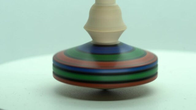 Spinning tops made of wood on a white background