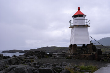 Obraz premium Laukvik, Norway - July 17, 2022: Laukvik Fyr is a coastal lighthouse in the Lofoten Islands in Nordland county. Selective focus.