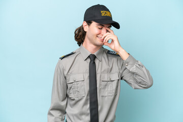 Young safeguard man isolated on blue background laughing