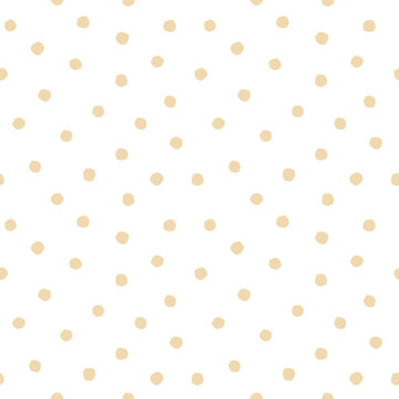 Beige roughly painted polka dot on white background. Seamless pattern. For wallpaper, textile, wrapping paper, packaging design and interior decoration