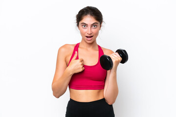 Fototapeta na wymiar Young sport caucasian woman making weightlifting isolated on white background with surprise facial expression