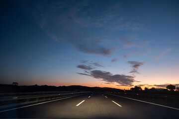 On the Road before Sunrise with cloudscape