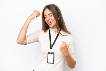 Young pretty woman with ID card isolated on white background celebrating a victory