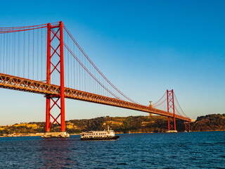 Stunning view of the 25 de Abril (25th April) suspension bridge crossing the Tagus river, Belem...