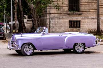 pink convertible classic car on the streets of havana cuba