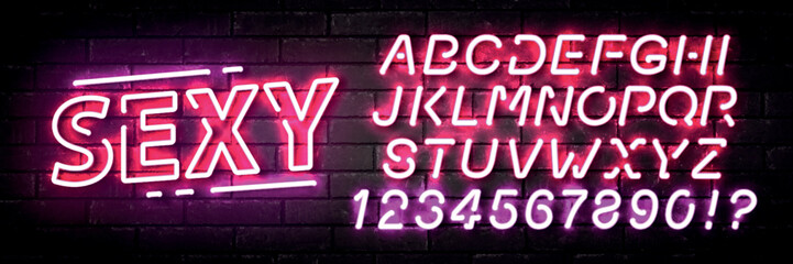 Fototapeta Vector realistic isolated neon sign of Sexy text with easy to change color alphabet font on the wall background. obraz