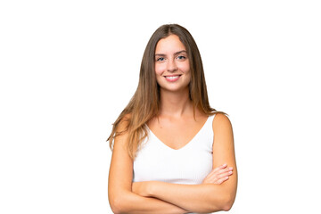 Young pretty woman over isolated background keeping the arms crossed in frontal position
