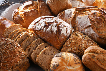 Assorted bakery products including loafs of bread and rolls