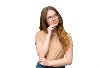 Young pretty woman over isolated background and looking up