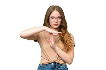 Young pretty woman over isolated background making time out gesture