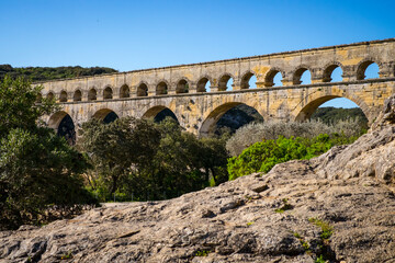 Obraz premium Roman aqueduct Pont du Gard and natural park in Languedoc, France