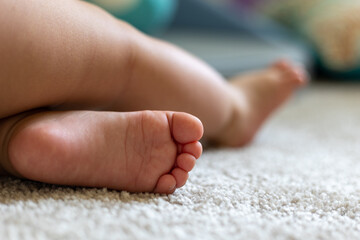 Little baby feet on a blanket