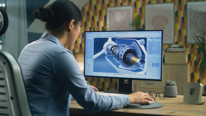 Asian female engineer drawing wind turbine 3D spare part in professional 3D modeling program on pc while working on project at home office