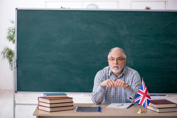Old english language teacher in the classroom