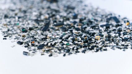 Abstract indoor shot of various scattered electronic parts in the shades of black placed together in stack. Modern technology concept. High quality photo