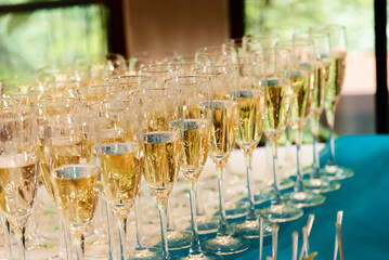 Champagne glasses on gold background. Party and holiday celebration concept