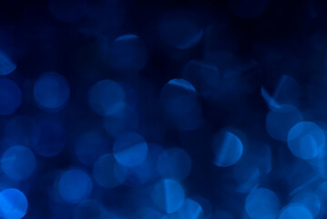 Blue bokeh fading to black at top