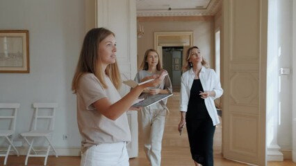 Young professional art agency contemplating luxury mansion hall for wedding organization