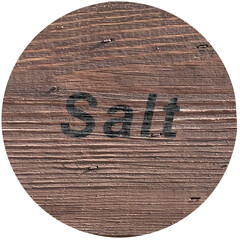 Lid label salt on wooden texture 
