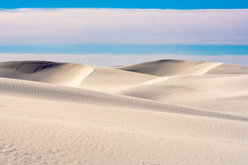 Smooth Untouched Dunes Under A Cloudy Sky