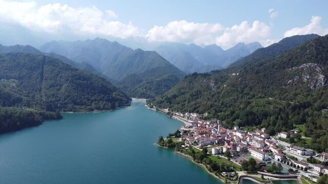 Scenic aerial footage of Barcis, Italy. Fascinating aerial views of Barcis Village, Lake Barcis and Dolomites mountains (Alps).